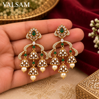 VALSAM green stone chandelier jhumka earrings held in hand