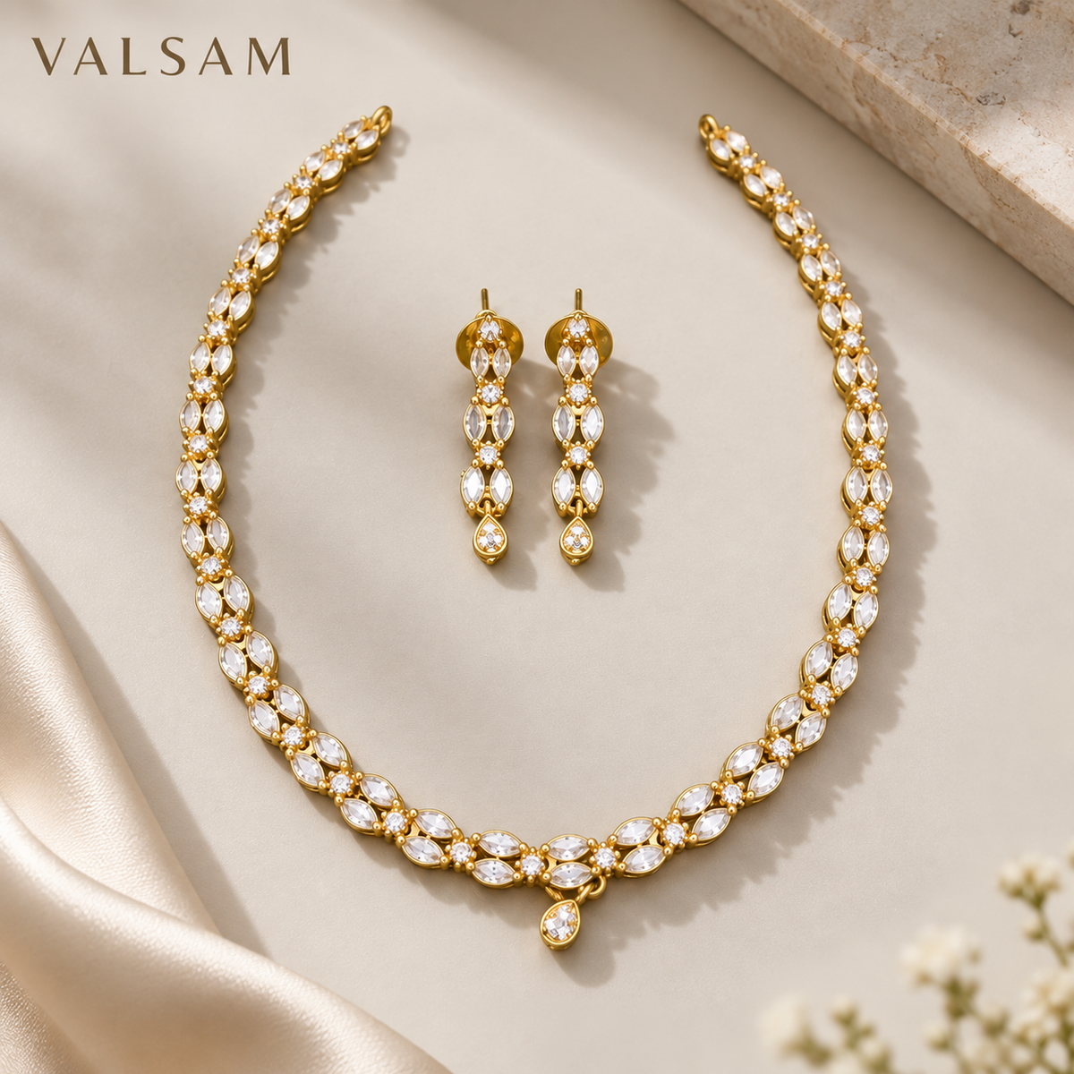 VALSAM crystal necklace and earrings set flat lay